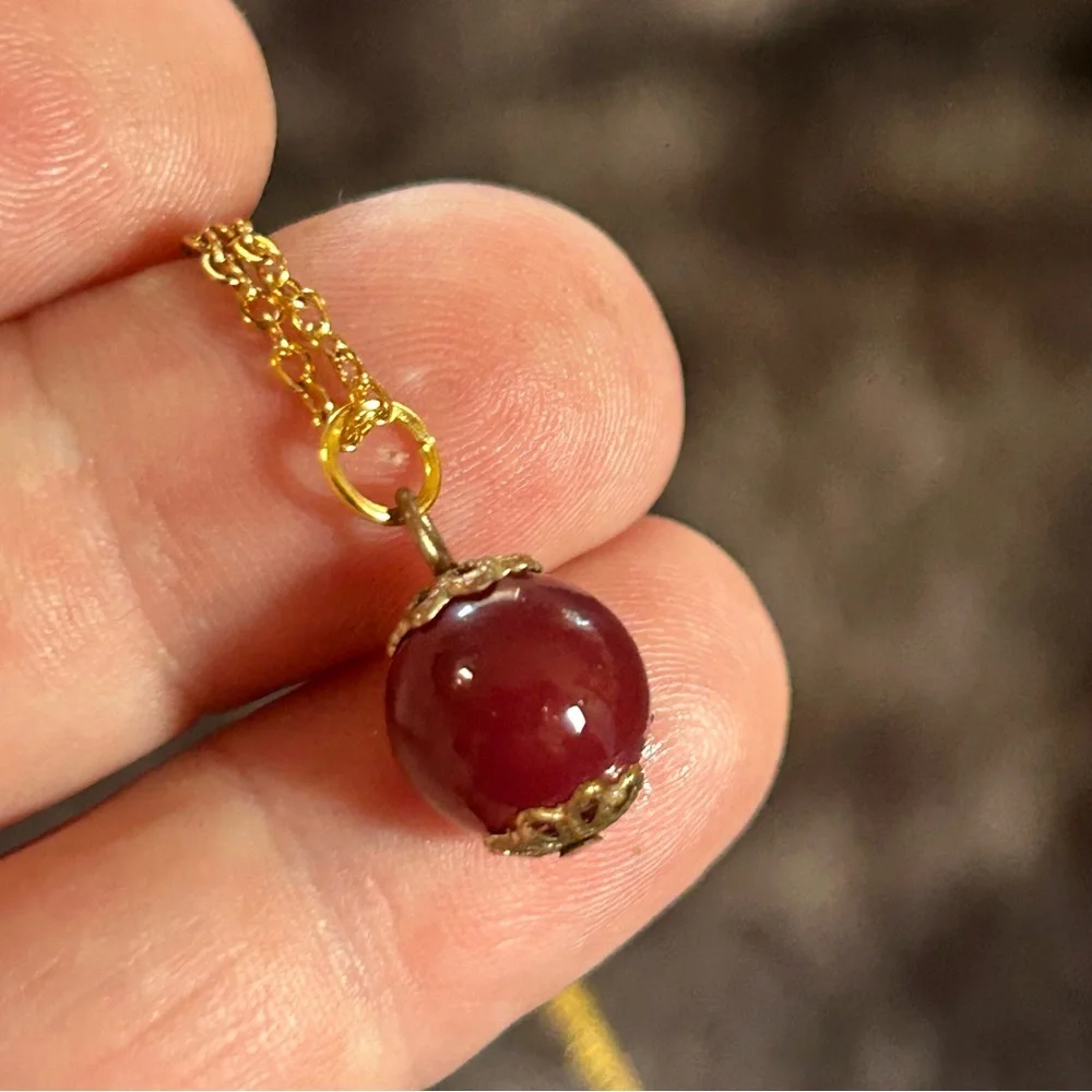 Handcrafted vintage bead capped burgundy glass pendant on chain necklace